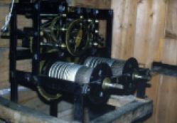 Movement of the turret clock, by Whitehurst of Derby, c1765, at Shugborough Hall in Staffordshire (National Trust). This is of the 'double frame' construction where the barrels are extended at the front to allow more turns of line.