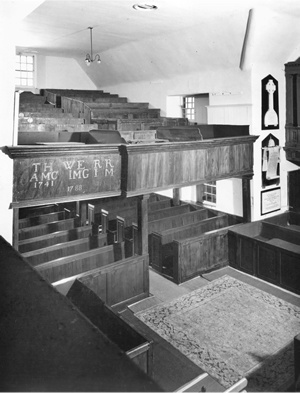 B/w photo of the interior of Cromarty East Church showing the timber north gallery