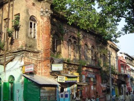 Dilapidated historic building with shops at ground floor level