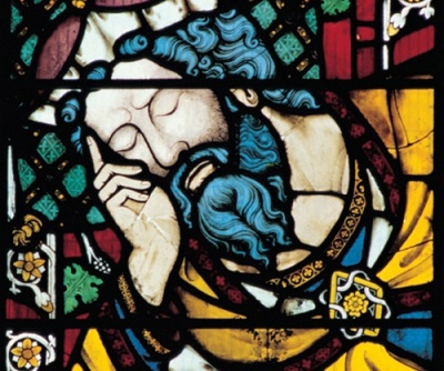 The bearded figure of Jesse, father of David, eyes closed in sleep