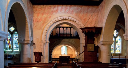 Limewash and geometric decoration to a chancel arch