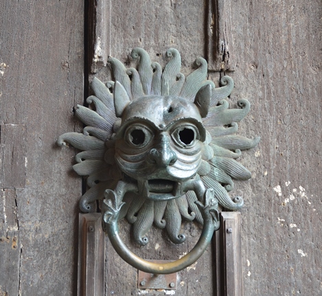 Door knocker in the form of a grotesque face or 'green man'