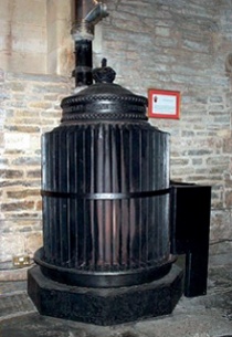 Converted warm-air stove in church interior