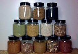 Stacked jars of sands and aggregates