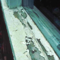 Flaking paintwork on a timber sill