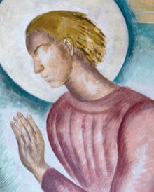 Wall painting detail of blonde-haired male figure with halo