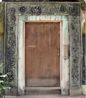 Bronze door surround with elaborate foliate decoration