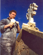 Andrew Gerard, stone mason, fixing a cross at St Mary's Church, Hemel Hempstead.