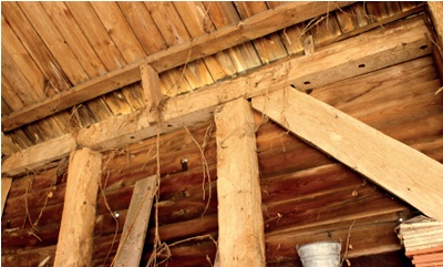 Holes in the underside of a beam provide evidence of infill panels