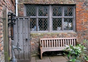 Early leaded and timber mullioned window without arch or lintel support