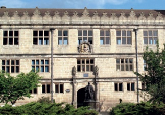 Library facade with statue of Charles Darwin in front of it