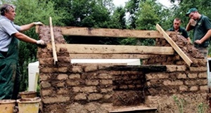 Clay dabbin with incomplete roof (exposed ridge and purlins)