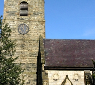 Church roof in which many slates have been re-fixed with tingles