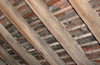 Peg tiles and nail fixings viewed from inside roof space