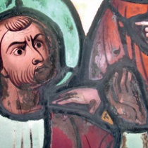 Localised limescale deposits on a stained glass window