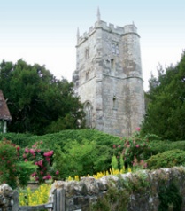Medieval church tower with crocketted finials and crenellated parapet