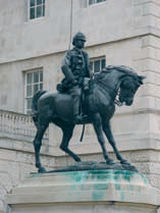 Stone plinth showing copper sulphate staining