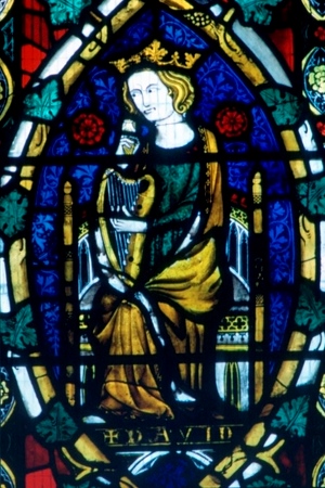 King David seated on throne and holding a harp