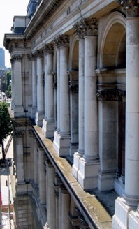 Neo-classical facade with engaged columns and arched windows