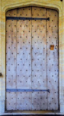 Front of a double plank door with planks running vertically