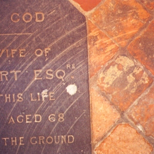 Tiles scratched by grit trapped under church door