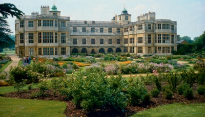 Audley End, Essex with colourful flower garden in the foreground