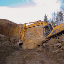 Excavator working in quarry