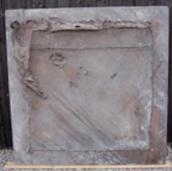 Dilapidated back of hatchment before restoration