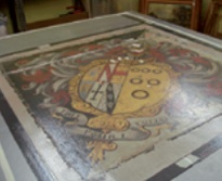 Hatchment canvas under vacuum pressure