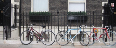 Repaired and painted Georgian railings with parked bicycles in front of them
