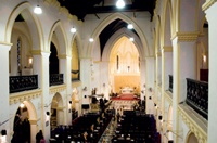 St James': view of interior from gallery level facing towards apse