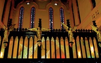 Gilded angels mounted on timber screen