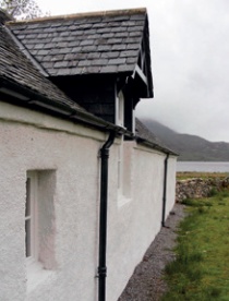 Church exterior wall with harling and white limewash finish