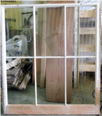 Complete repaired sash leant upright in workshop ready for painting