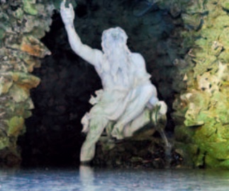 Statue of Neptune seated on a rock in a grotto alcove