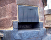 Bat access point in stone turret: the access point is a horizontal rectangular opening edged with lead flashings