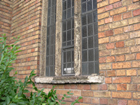 Decayed exterior of concrete mullions