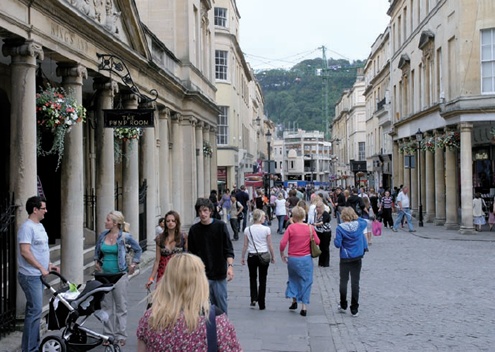 Shoppers surrounded by listed buildings in Bath, Somerset