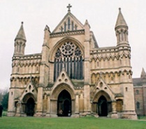 The same facade heavily embellished with gothic revival features including turrets and elaborate blind arcade work