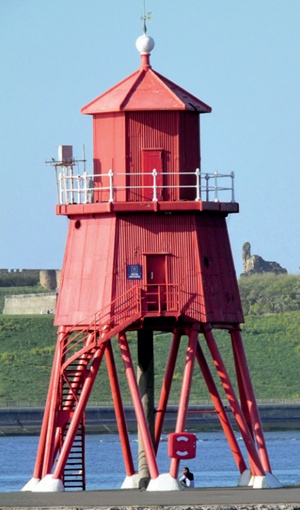 Corrugated iron lighthouse painted a striking shade of red