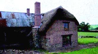 Thatched cottage with cob wall extension