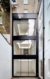 Three-storey glazed infill extension - exterior
