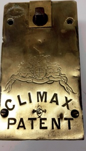 Brass cover plate bearing a crest above the words 'CLIMAX PATENT'
