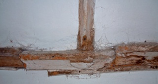 Section of wall plate before conservation with black injection nodules clearly visible