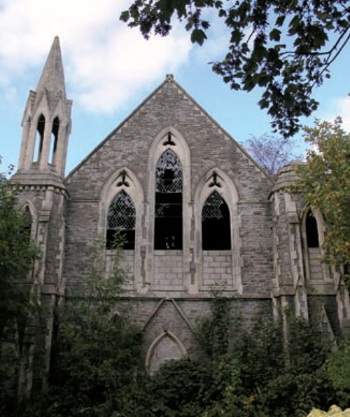 The broken windows and overgrown surroundings of the Congregational Church at Kingswood