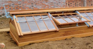 Modern cold frame with timber with stained or varnished finish