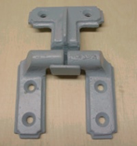 Close-up showing gray-painted hinges with countersunk screw holes