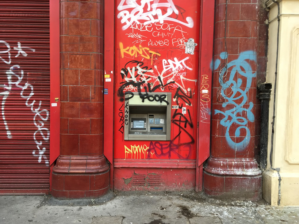 spray painted graffiti on glazed terracotta