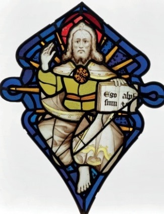 Representation of God the Father with right hand raised and left hand holding a book bearing the Latin text: 'Ego sum alpha et omega'