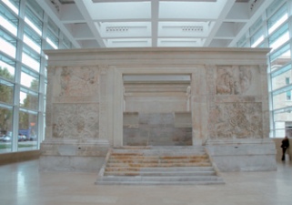 A complete historic stone structure shelters inside Rome's Ara Pacis Museum